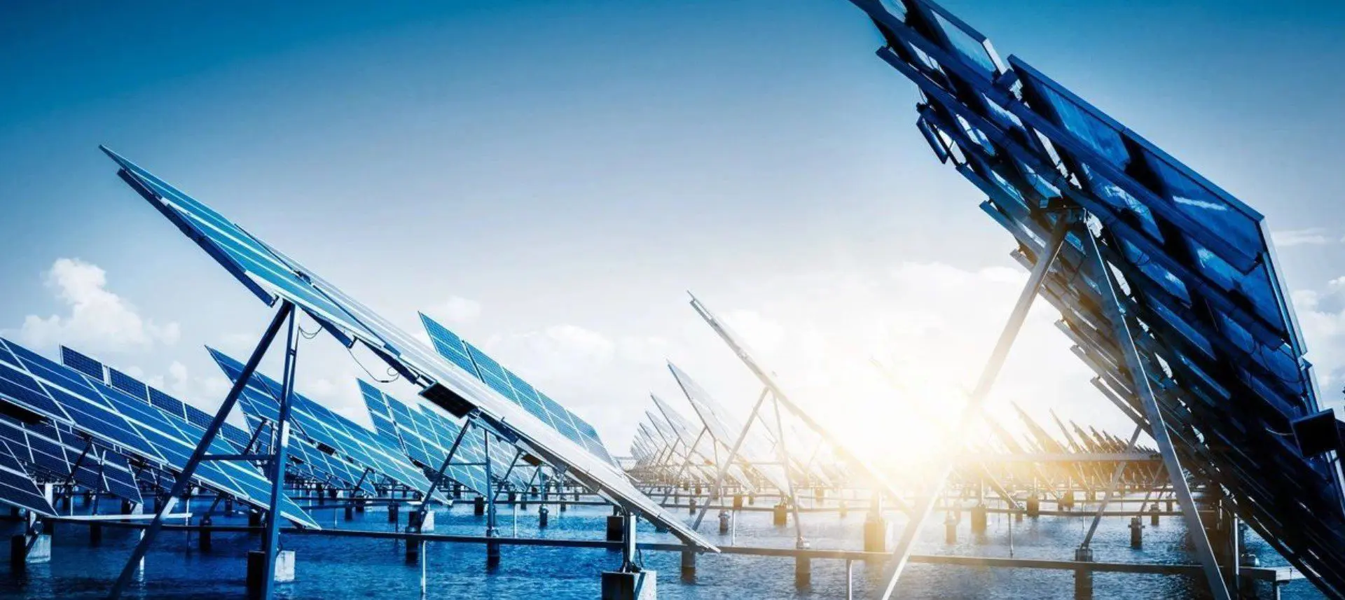 A group of solar panels sitting next to each other.